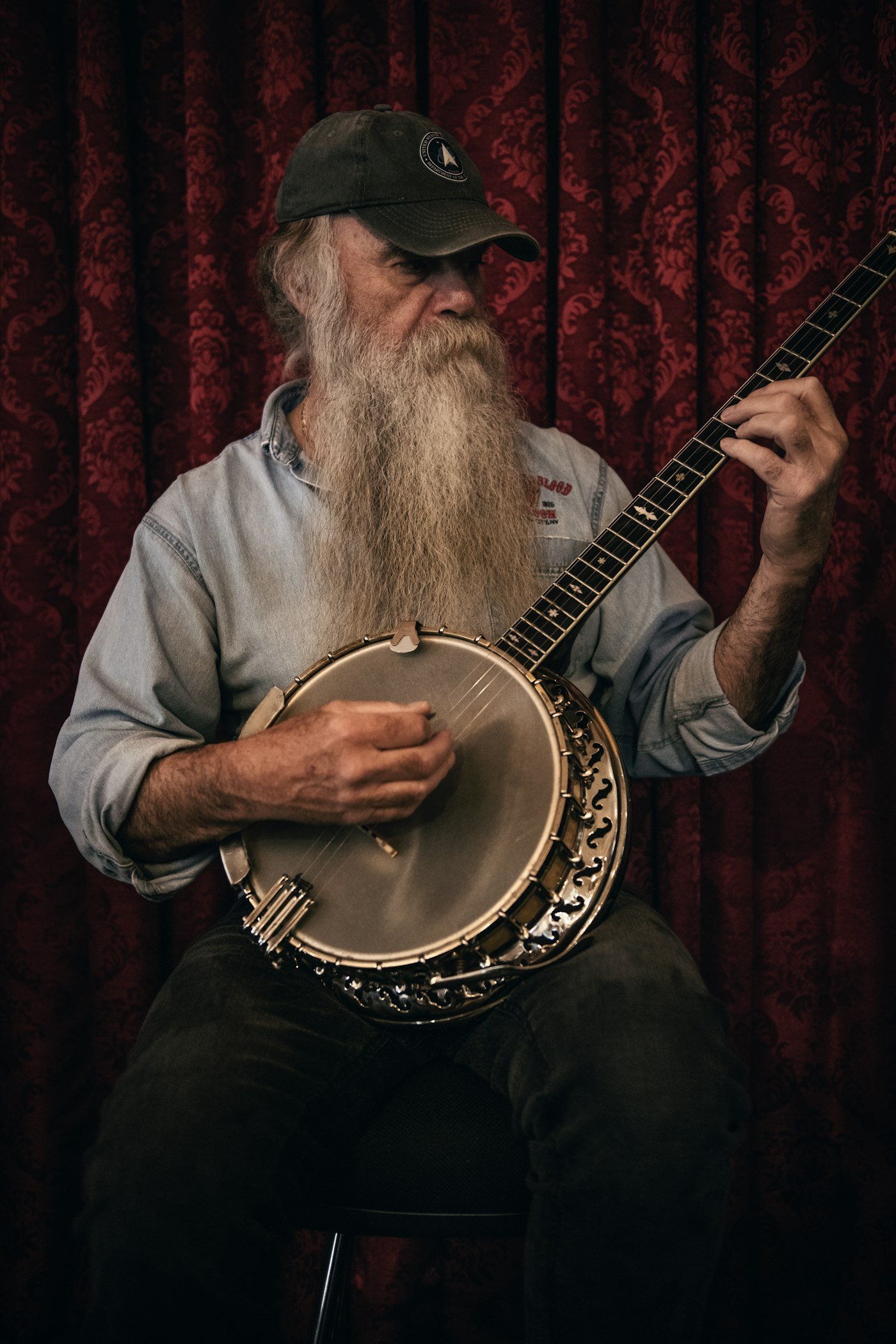 Bruce, Silverwood Music instructor, holding his guitar